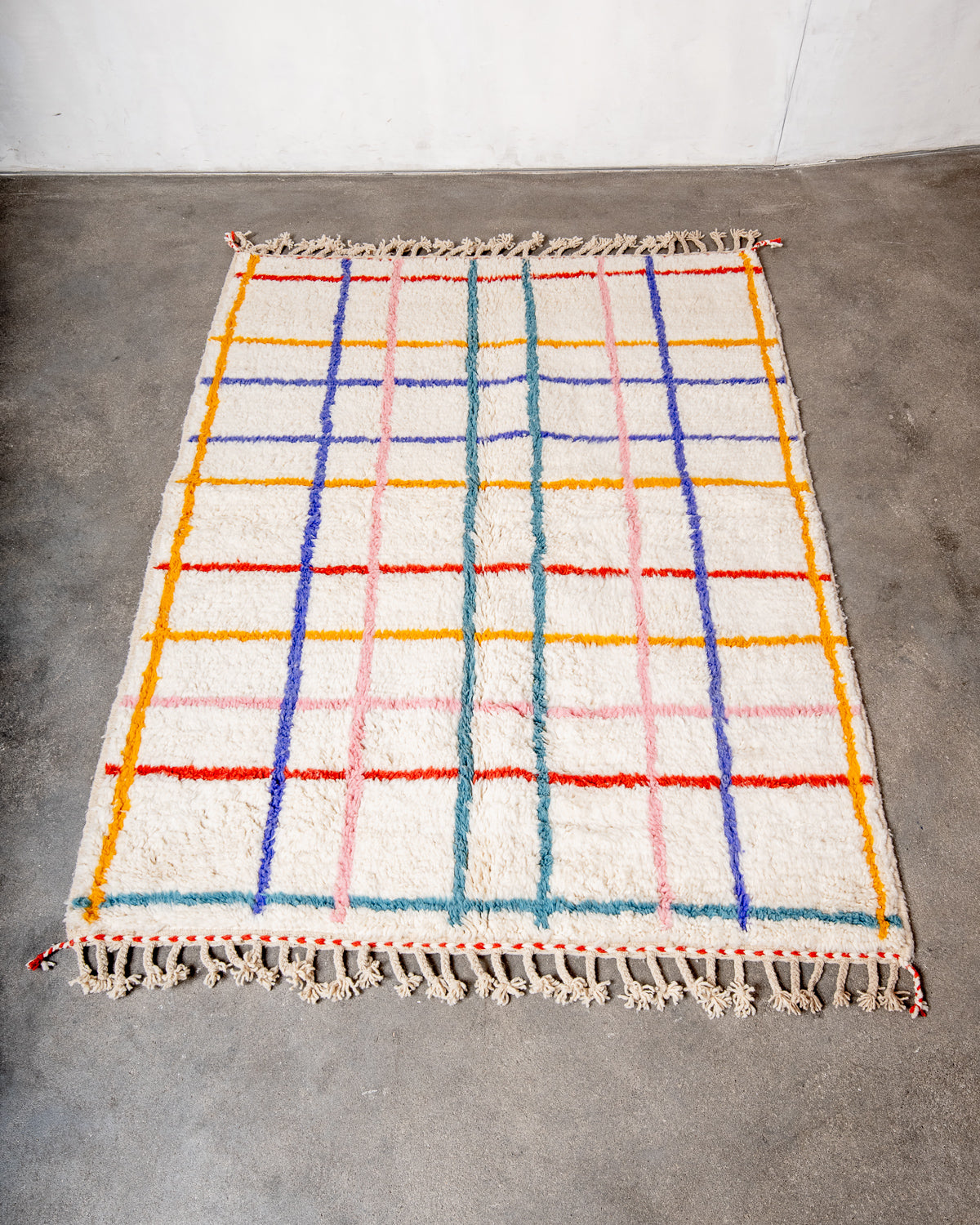 Modern, designer, handcrafted Berber rug from Morocco. Beniourain carpet with beautiful colours and patterns and fluffy wool texture.